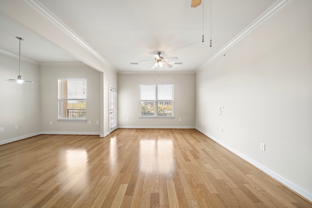 spare room featuring ceiling fan, crown molding, and light hardwood / wood-style flooring