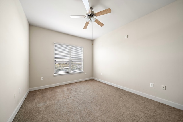 empty room featuring ceiling fan and carpet floors