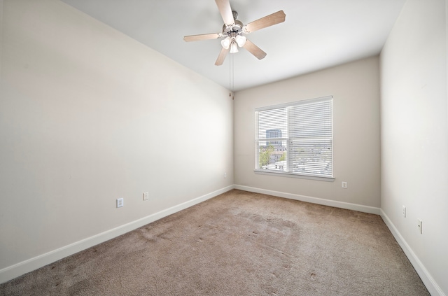 carpeted empty room with ceiling fan