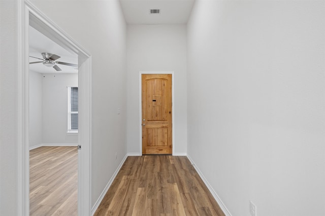 corridor featuring light wood-type flooring