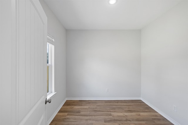 empty room with light hardwood / wood-style flooring