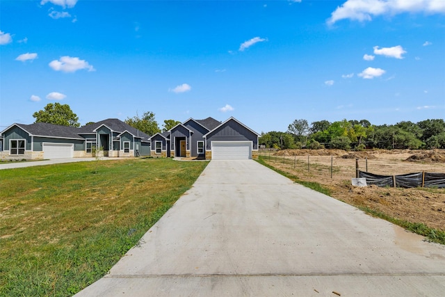 ranch-style home with a front yard and a garage