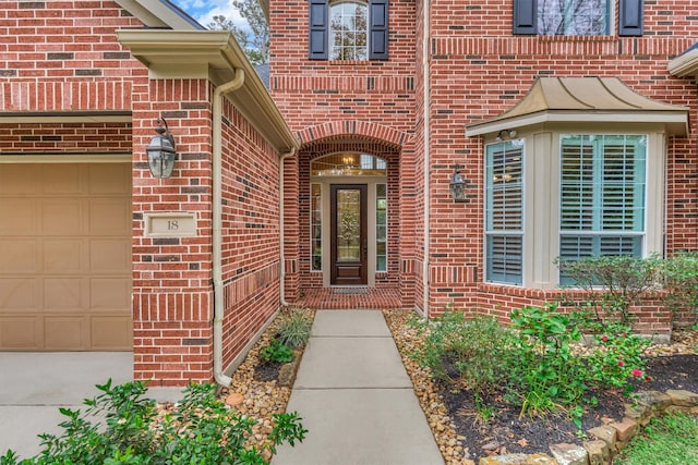 view of exterior entry featuring a garage