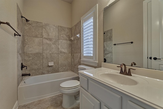 full bathroom featuring tile patterned floors, toilet, vanity, and tiled shower / bath