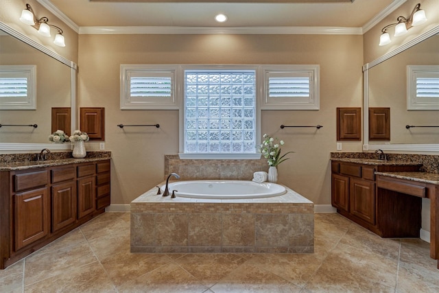 bathroom featuring tiled bath, crown molding, and vanity