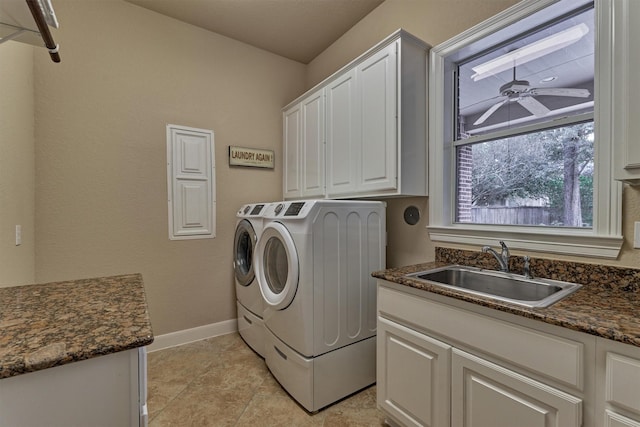 laundry room featuring cabinets, sink, ceiling fan, separate washer and dryer, and light tile patterned floors