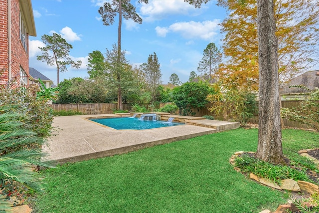 view of swimming pool featuring a lawn and a patio