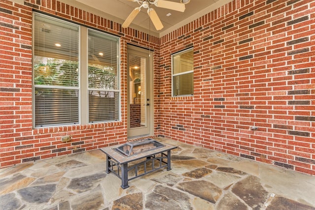 view of patio featuring ceiling fan