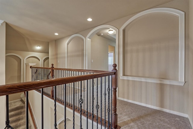 corridor with light colored carpet