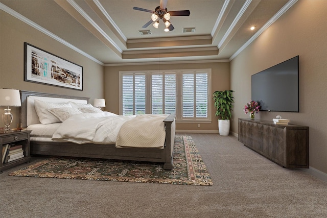 bedroom with carpet, ceiling fan, a raised ceiling, and ornamental molding