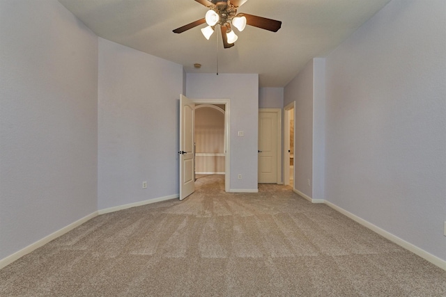 unfurnished bedroom with light colored carpet and ceiling fan