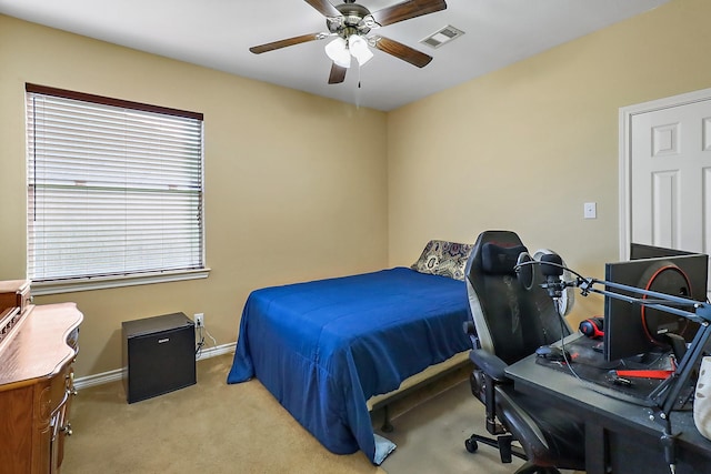 carpeted bedroom with ceiling fan