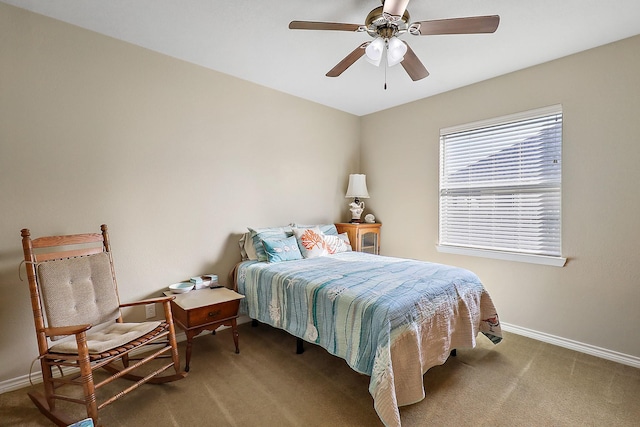 bedroom featuring ceiling fan and carpet