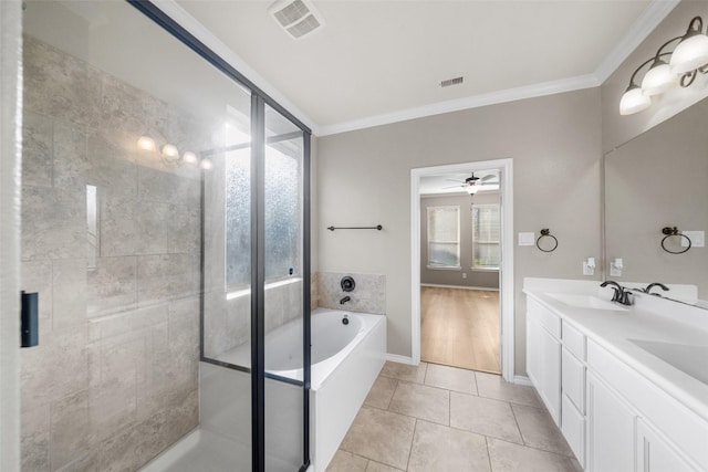 bathroom with vanity, plus walk in shower, tile patterned flooring, ceiling fan, and ornamental molding