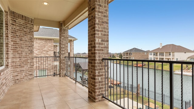 balcony featuring a water view