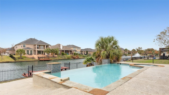 view of swimming pool with a water view