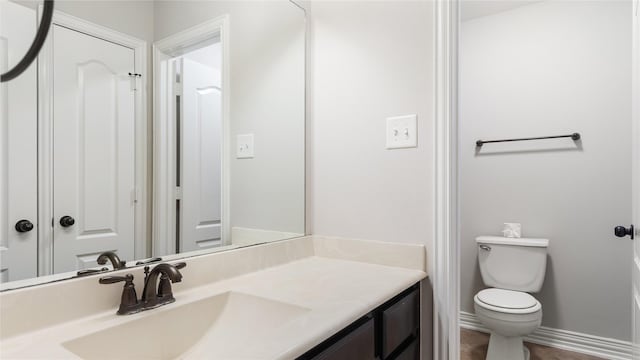 bathroom with tile patterned floors, vanity, and toilet