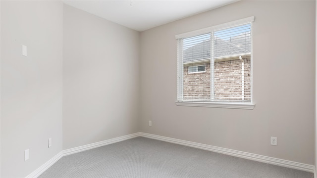 carpeted empty room with a healthy amount of sunlight