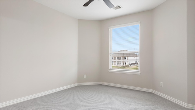 unfurnished room with carpet flooring and ceiling fan