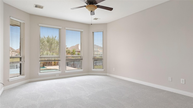 spare room with carpet flooring and ceiling fan