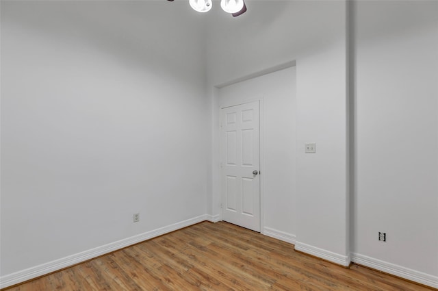 empty room with hardwood / wood-style flooring