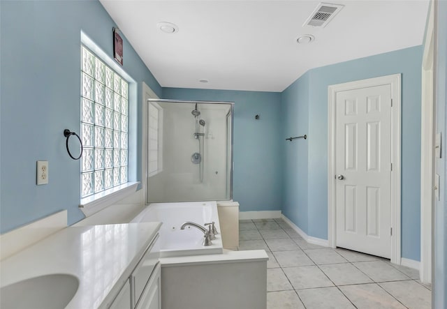 bathroom featuring tile patterned flooring, vanity, separate shower and tub, and a healthy amount of sunlight