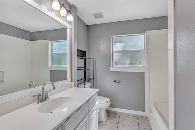 full bathroom with toilet, vanity, tile patterned floors, and plenty of natural light