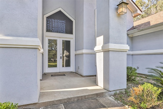 property entrance featuring french doors