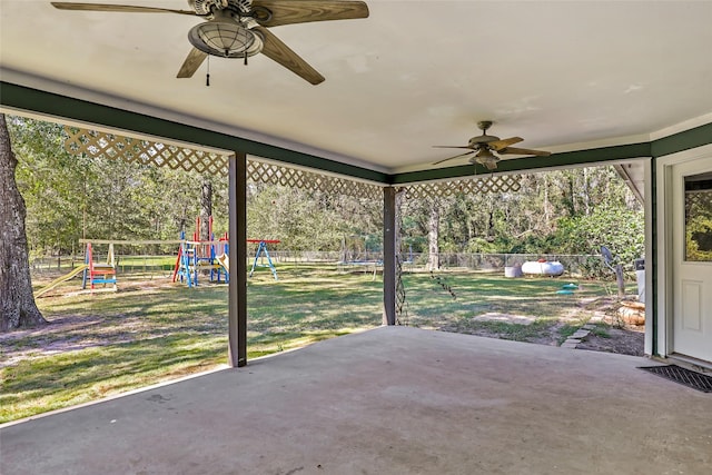 view of patio / terrace with a trampoline, a playground, and ceiling fan