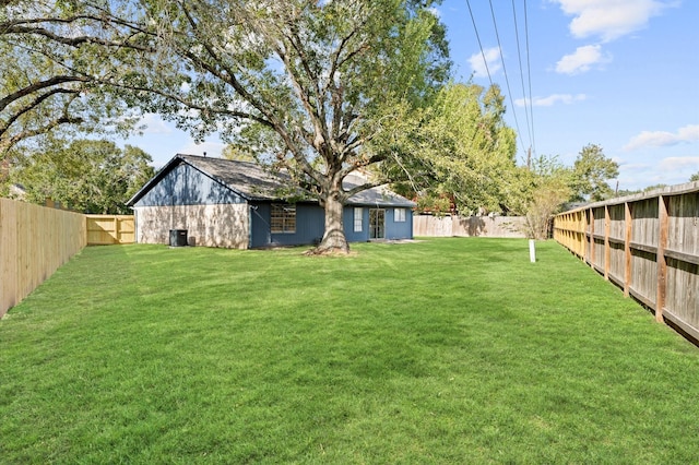 view of yard with a fenced backyard