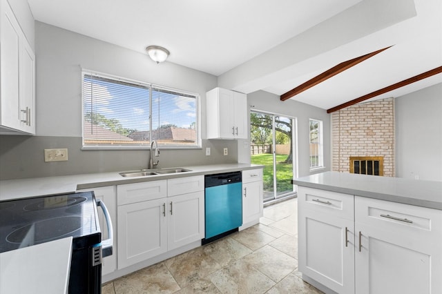 kitchen featuring a healthy amount of sunlight, dishwashing machine, light countertops, and a sink