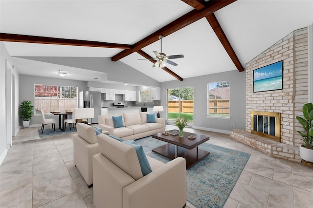 living area featuring a fireplace, ceiling fan, high vaulted ceiling, beamed ceiling, and baseboards