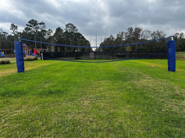 surrounding community featuring a playground and a yard