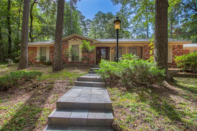 ranch-style house with brick siding