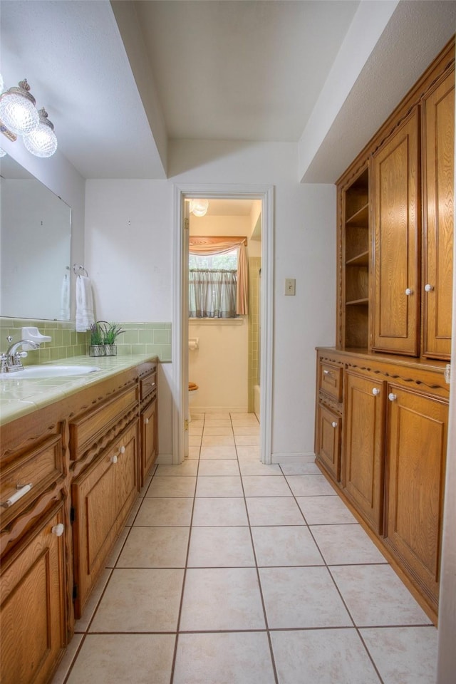 bathroom featuring backsplash, vanity, and tile patterned floors