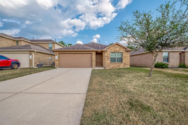 ranch-style house featuring a garage and a front yard