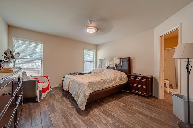 bedroom featuring ceiling fan and dark hardwood / wood-style flooring