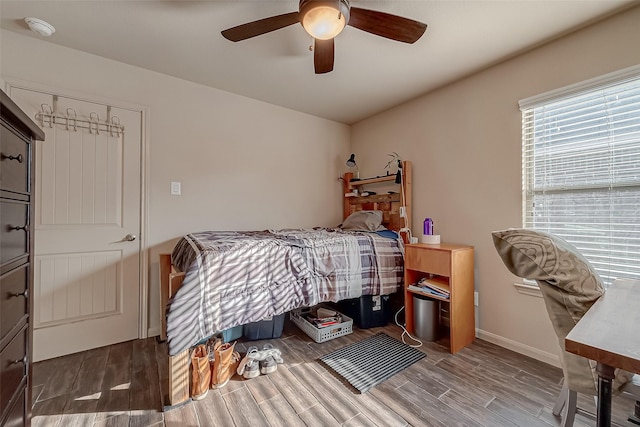 bedroom featuring hardwood / wood-style flooring and ceiling fan