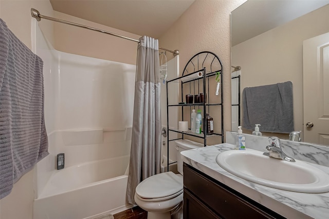 full bathroom featuring hardwood / wood-style flooring, shower / bath combination with curtain, toilet, and vanity