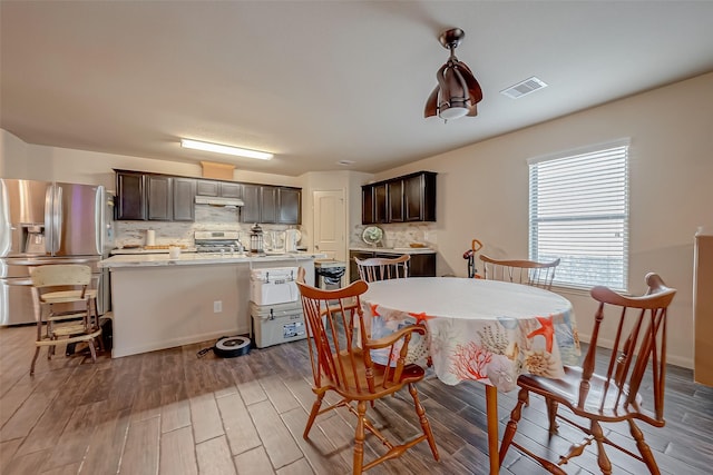 dining space with light hardwood / wood-style flooring