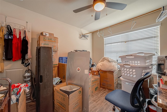 interior space with ceiling fan