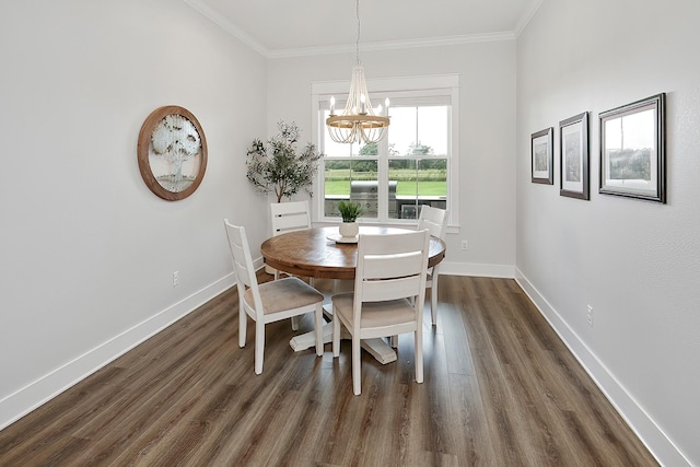 dining room featuring a chandelier, dark hardwood / wood-style flooring, and ornamental molding