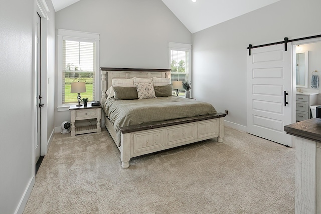 bedroom featuring a barn door, light colored carpet, high vaulted ceiling, and multiple windows