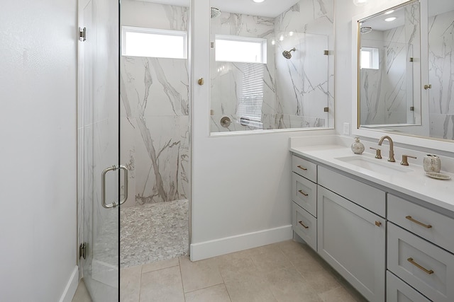 bathroom with vanity, tile patterned floors, and walk in shower