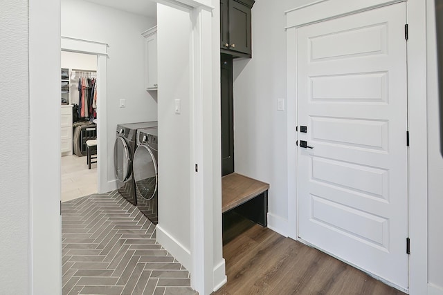 mudroom with washer and dryer and dark hardwood / wood-style floors