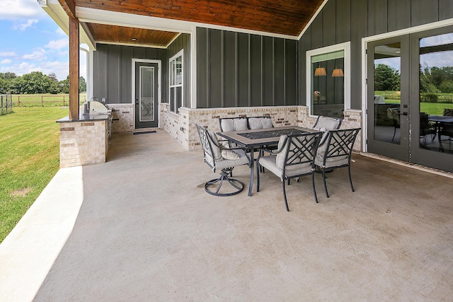 view of patio / terrace with an outdoor kitchen and french doors