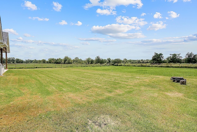 view of yard with a rural view