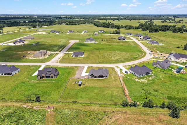 birds eye view of property featuring a rural view