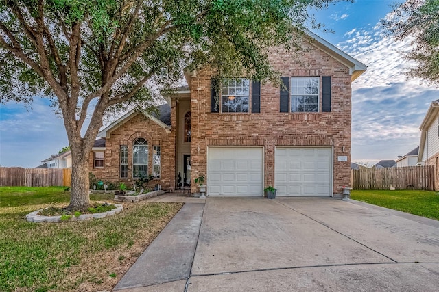 front of property with a front yard and a garage