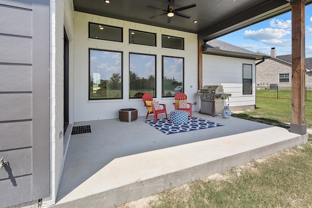 view of patio with grilling area and ceiling fan